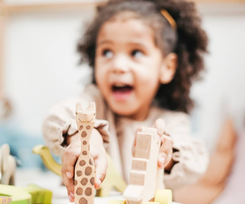 happy child playing with toys